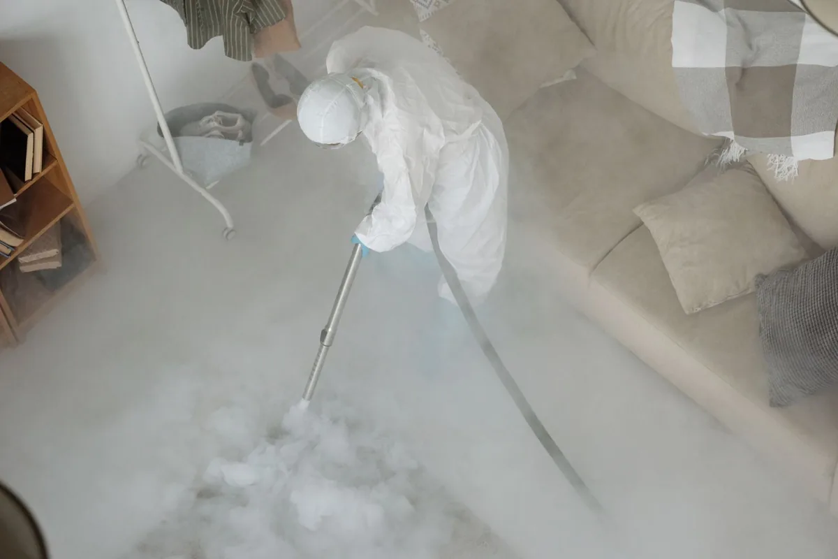 Biohazard cleanup technician in protective equipment, Watsonville, CA